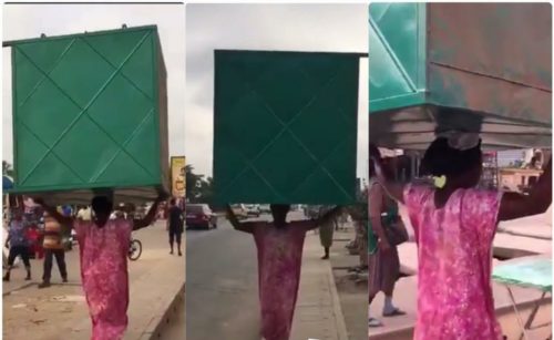 VIDEO: Ghana’s Strongest ‘Kayayoo’ Spotted Carrying A Heavy Metal Container On Her Head 1