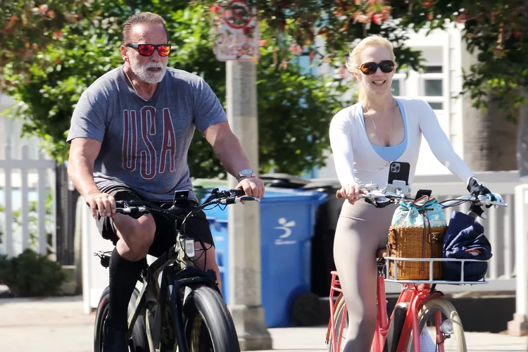 Arnold Schwarzenegger and Girlfriend Heather Milligan Enjoy Bike Ride Together After Workout 12