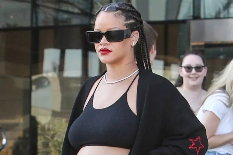 Rihanna Bares Baby Bump in Black Athleisure During West Hollywood Outing 27