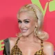 Gwen Stefani looks identical to her 90s alter-ego in corset top and fishnets 5