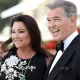 Pierce Brosnan's wife Keely Shaye Brosnan, 60, wows in slinky sequin dress as she snuggles up with husband 69