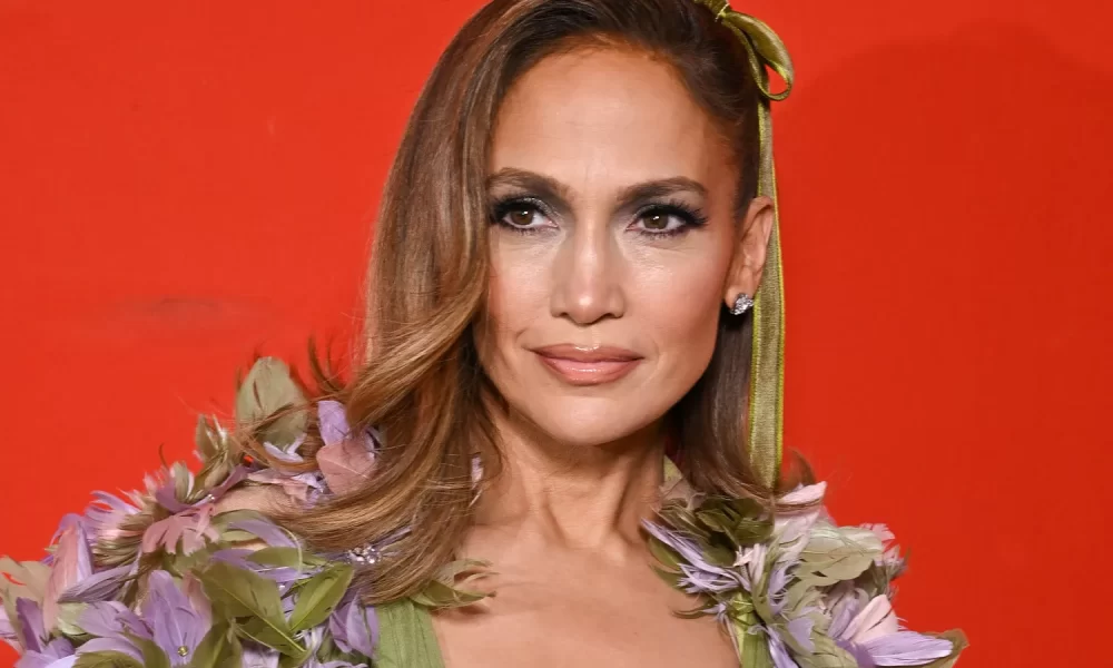 Jennifer Lopez Wore a Green Gown and Floor-Length Floral Cape to the Ellie Saab Couture Show 18